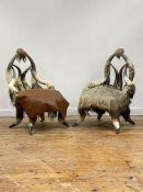 An unusual pair of late 19th / early 20th century shooting lodge cow horn and hide chairs. H86cm,