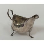 A George III Irish silver sauce boat, Matthew West, Dublin, 1787, of oval bellied form, with leaf-