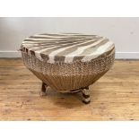 A tribal African Grant's Zebra hide covered drum table of tapered cylindrical form, standing on