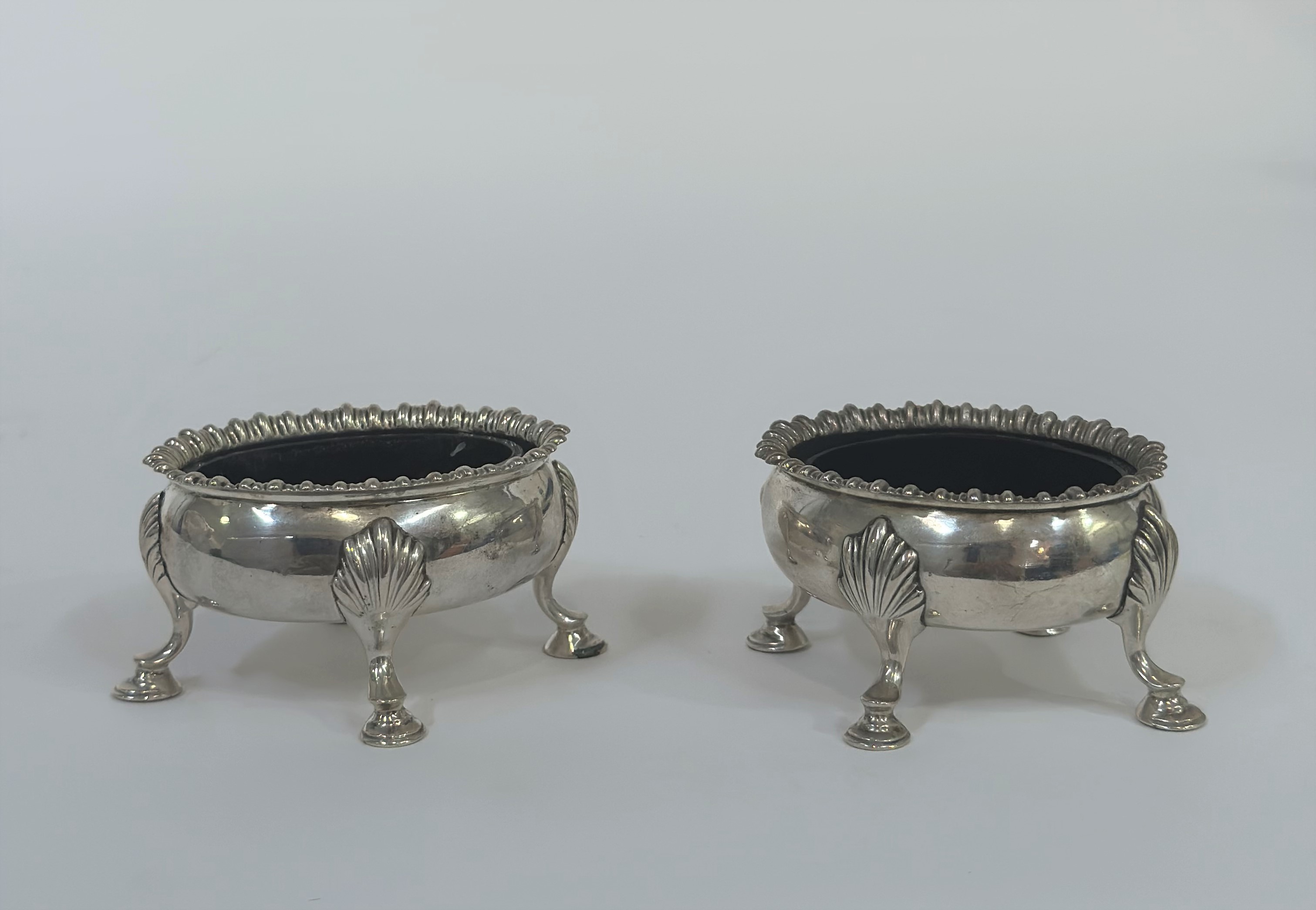 A pair of early George III silver cauldron salts, David and Robert Hennell, London 1768, of oval