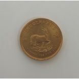 South Africa, 1974 gold full Krugerrand, obv; portrait of Stephanus Johannes Kruger, rev;