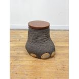 Taxidermy, an elephant foot lidded stool, with circular teak cover and lined interior. H48cm.