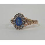 An Edwardian 9ct gold sapphire and seed pearl ring, hallmarked for Birmingham 1908, the central
