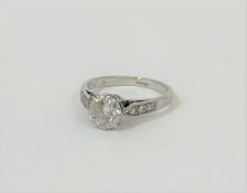 A single stone diamond ring, the round brilliant-cut stone weighing c. 0.9ct, claw-set on