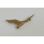 A vintage 9ct gold bird brooch, modelled as a gull in flight, the eye set with a red stone,