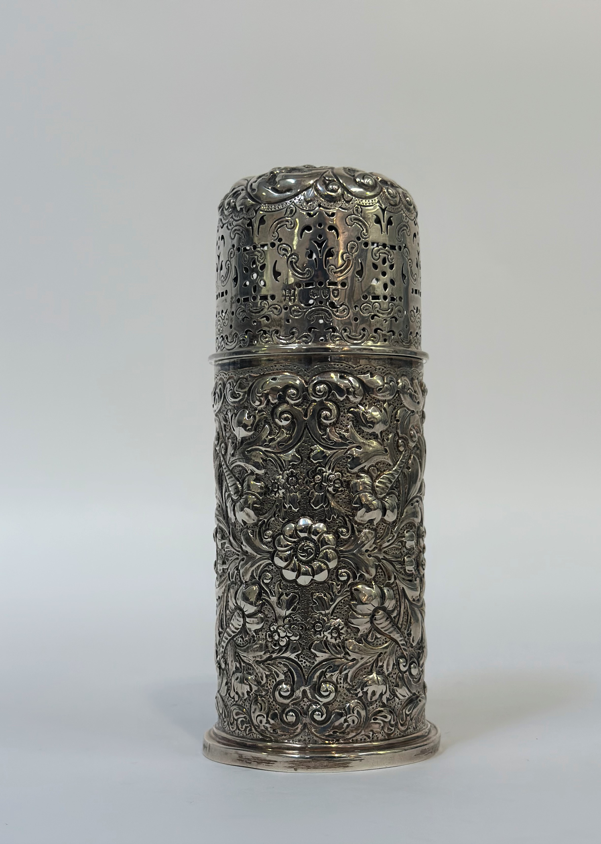 A late Victorian silver sugar caster, Horace Woodward & Co., London 1892, of cylindrical form,