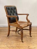 Heals, a mahogany library chair, circa 1860s, the back upholstered in original buttoned Morocco