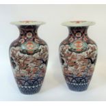 A pair of large Japanese Imari porcelain vases, Meiji period, c. 1900, of baluster form, painted