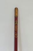 An Edward VII Coronation "Gold Staff" staff officer's baton, in red with gilt tips, dated 1902.