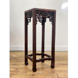 A late Qing dynasty Chinese rosewood jardiniere stand of rectangular outline, the panelled top