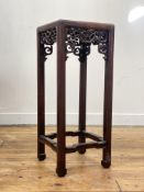 A late Qing dynasty Chinese rosewood jardiniere stand of rectangular outline, the panelled top