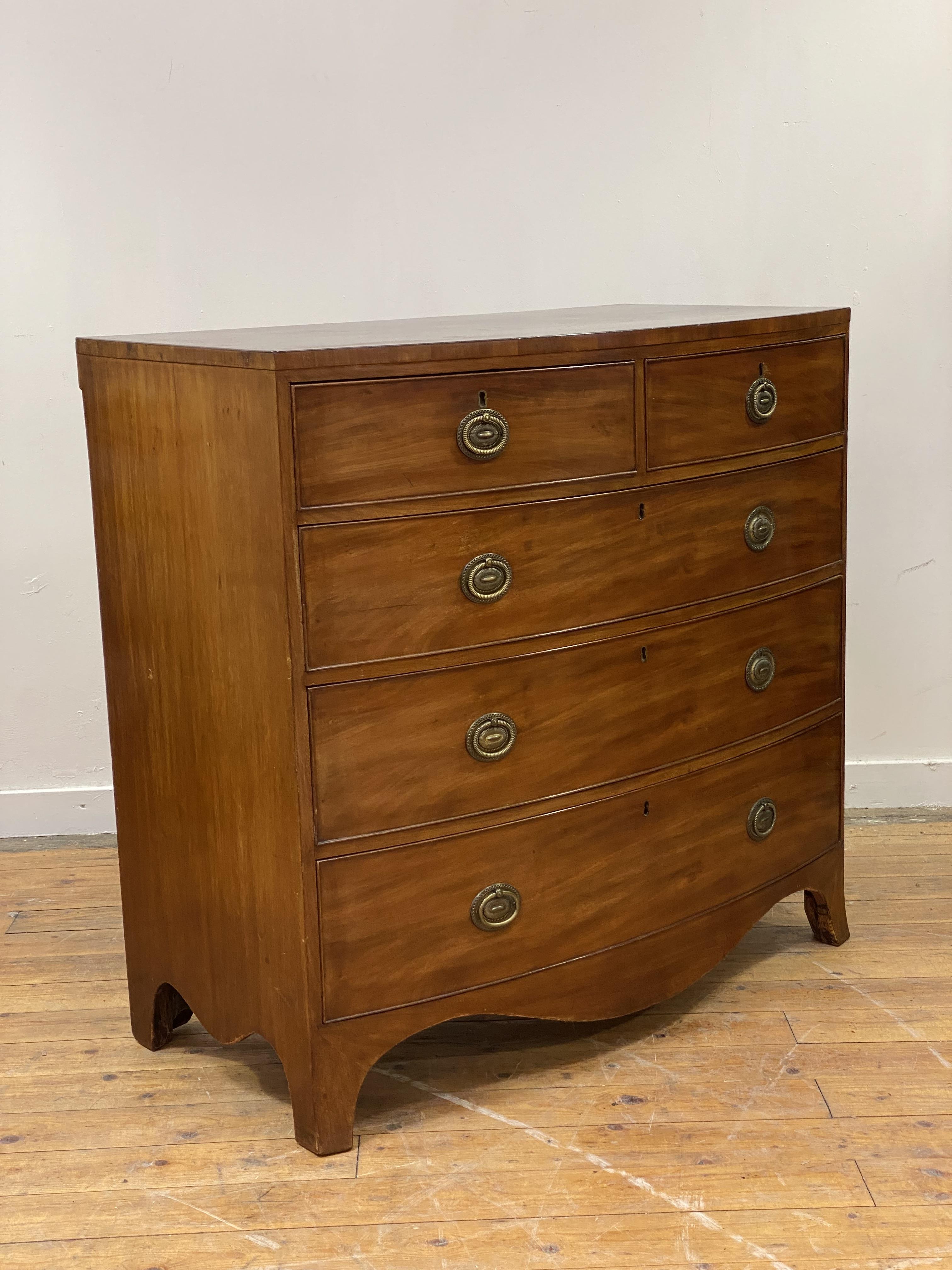 A Regency mahogany bow front chest, fitted with two short and three long graduated and cock beaded - Image 2 of 2