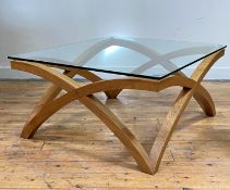 Peter Hill & Sons, a contemporary Oxford coffee table, the rectangular plate glass top raised on