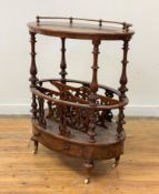 A Victorian figured walnut table canterbury of oval outline, the top with rope twist brass gallery