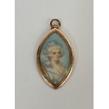 An English portrait miniature, c. 1790, of a lady with elaborately dressed hair, watercolour on