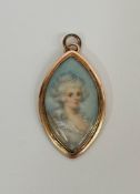 An English portrait miniature, c. 1790, of a lady with elaborately dressed hair, watercolour on