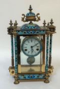 A French brass and champleve enamel four glass mantel clock, mid 20th century, the case with urn