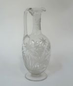 A 19th century acid-etched claret jug, of baluster form, with scalloped rim, the body etched with