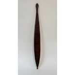 An Australian Aborigine Wommera (Spear Thrower), of slender form, the flat front carved with