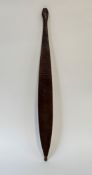 An Australian Aborigine Wommera (Spear Thrower), of slender form, the flat front carved with