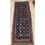 An antique Kurdish 'Blossom' design runner rug, third quarter of the 19th century, the blue field