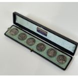 A cased set of six Edwardian silver buttons, Nathan & Hayes, Chester, 1901, in the Art Nouveau