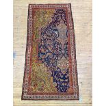 An Antique Persian Hamadan Wagireh rug, the deep blue field of a-symmetrical design framed within an