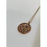A diamond-set 18ct gold pendant, the circular openwork mount modelled with a butterfly and