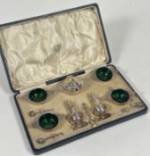 A George V cased silver condiment set, Josiah Williams & Co., London 1917, comprising four salts,