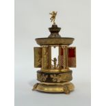 A 1960's American novelty musical cigarette dispenser in the Rococo taste, cast metal and brass