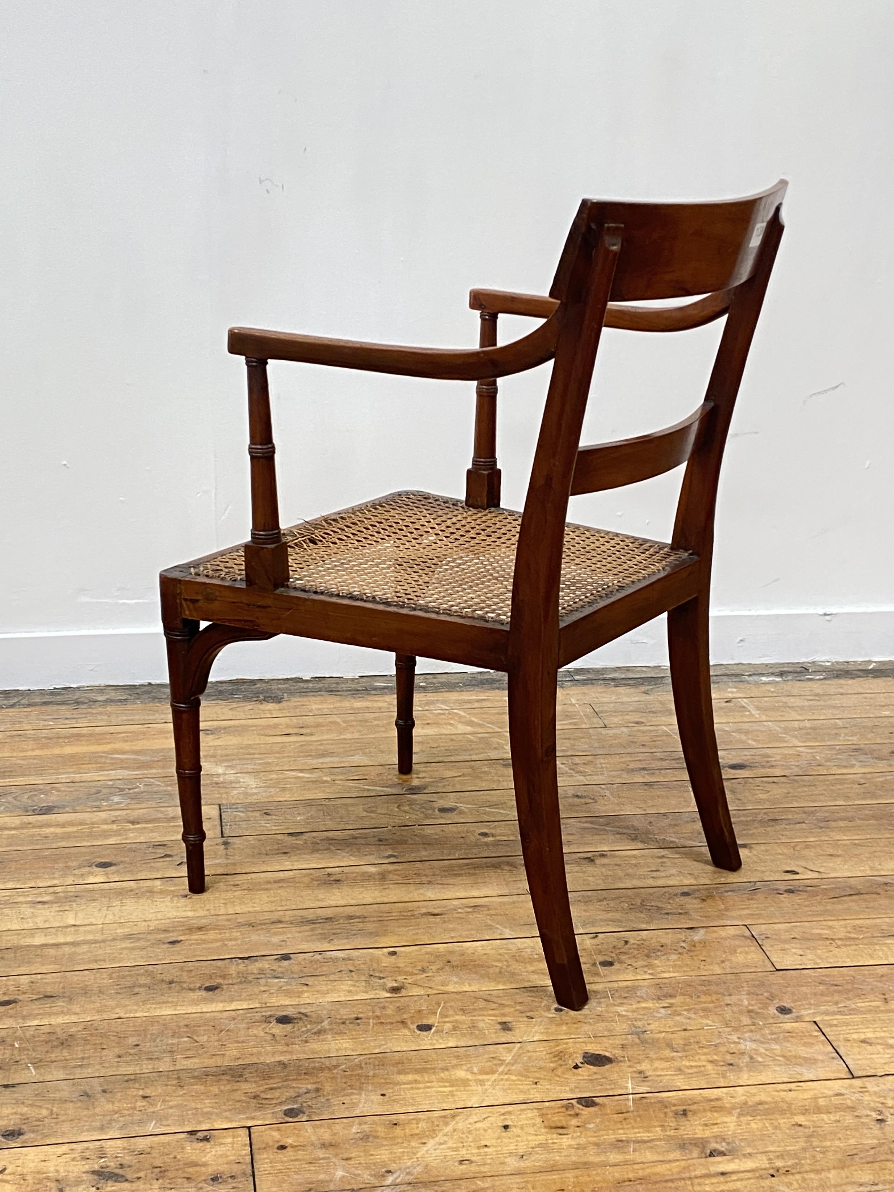 A Regency period yew wood elbow chair, the crest rail inlaid with ebony bands, above reeded open - Image 5 of 5
