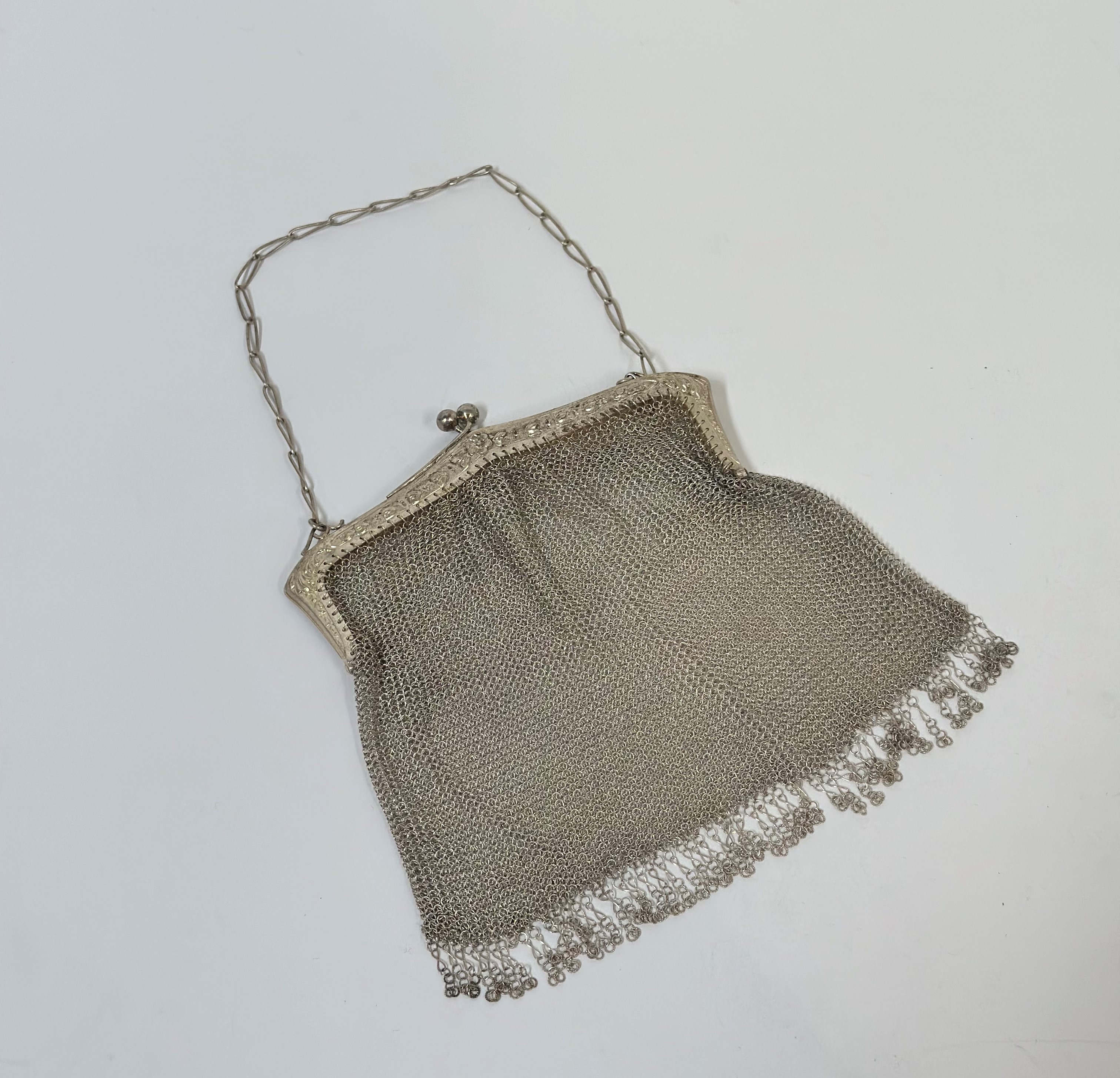 A Portuguese 833 standard silver mesh evening bag, second quarter of the 20th century, the pierced