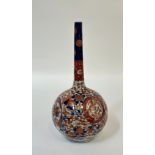 A Japanese Imari porcelain bottle vase, probably late 19th century, the spherical body beneath a