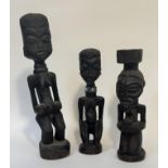 Two carved wooden fertility figures, probably Yombe, Congo, together with a carved figure of a