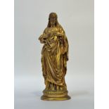 A gilt-bronze figure of Christ displaying the Sacred Heart, unsigned. 30.5cm