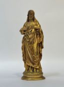 A gilt-bronze figure of Christ displaying the Sacred Heart, unsigned. 30.5cm