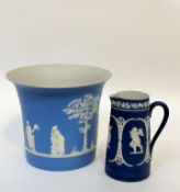 A large light blue and white Dudson Jasperware plant pot decorated with classic scene ( h- 27cm w-