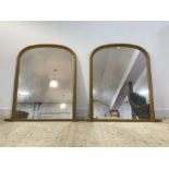 A pair of Victorian style gilt framed over mantel mirrors with arched tops 139cm x 132cm