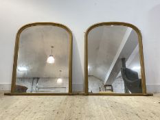 A pair of Victorian style gilt framed over mantel mirrors with arched tops 139cm x 132cm