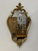 A Rococo style gilt framed wall hanging mirror 86cm x 50cm