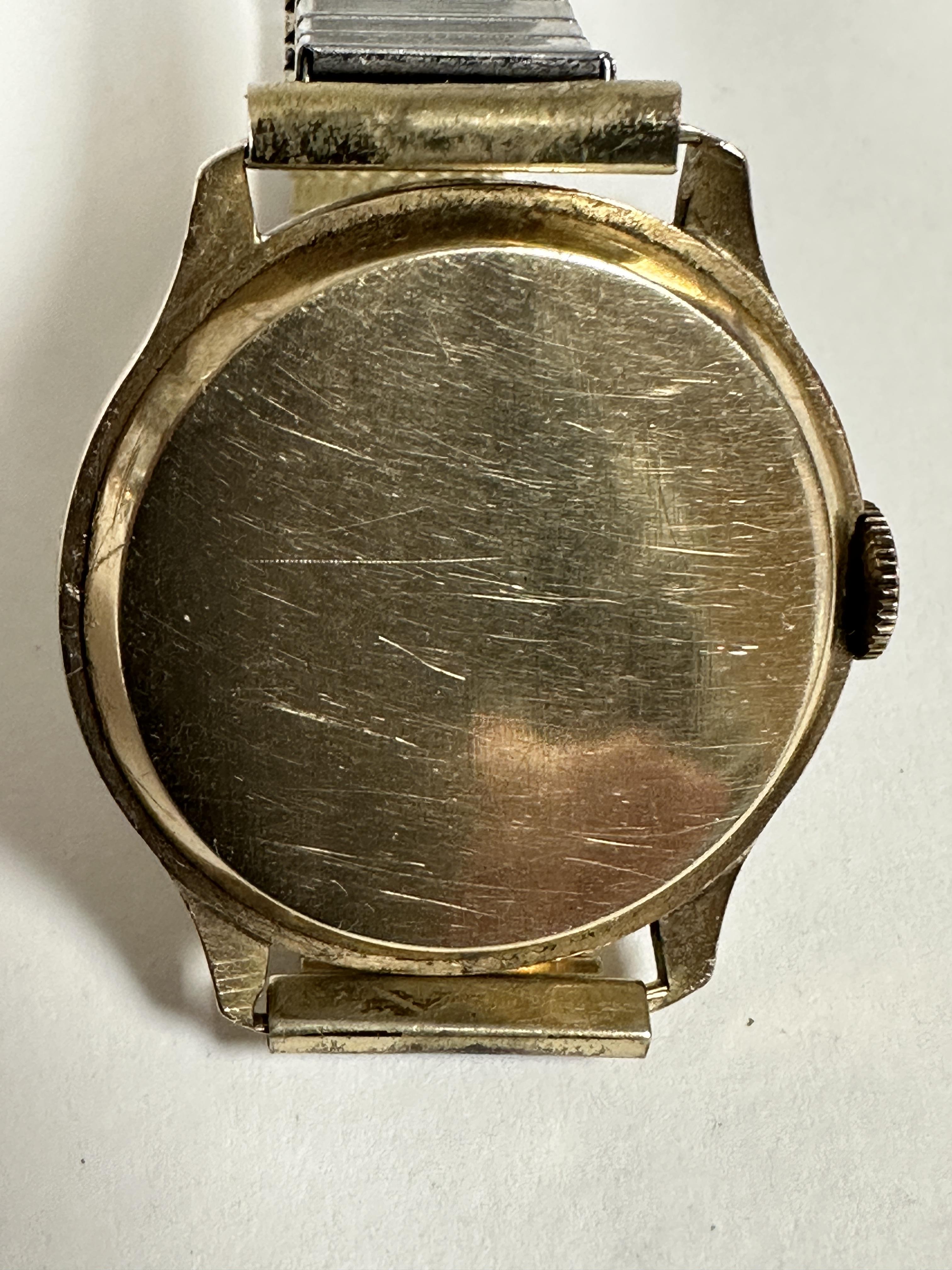 A gentleman's vintage 1930s/40s 9ct gold wristwatch with silvered dial and arabic numerals and - Image 2 of 2