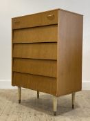 A mid century oak veneered chest, fitted with five drawer, raised on turned supports. H105cm, W76cm,