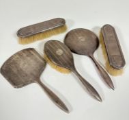 An Edwardian Birmingham silver engine turned hair brush and hand mirror, (a/f) and a Birmingham