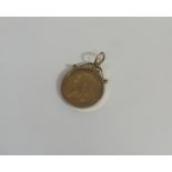 A Queen Victoria gold sovereign, 1899, mounted in 9ct gold frame with suspension ring (9.77g