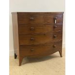 A Georgian mahogany bow front chest, fitted with two short and three long graduated drawers,