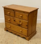 A late 20th century polished pine chest, fitted with two short and two long drawers, raised on