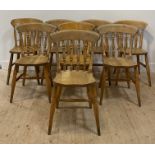 A matched set of eight (6+2) Farmhouse beech dining chairs, with spindle backs