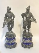 A pair of 19thc style cast metal figures of Soldiers in chain mail and half suits of armour,