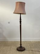 An early 20th century turned mahogany standard light with shade H154cm (excluding shade)