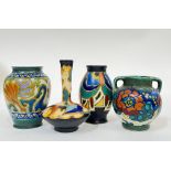 A group of four Gouda pottery miniature vases comprising a squat vase with abstract decoration